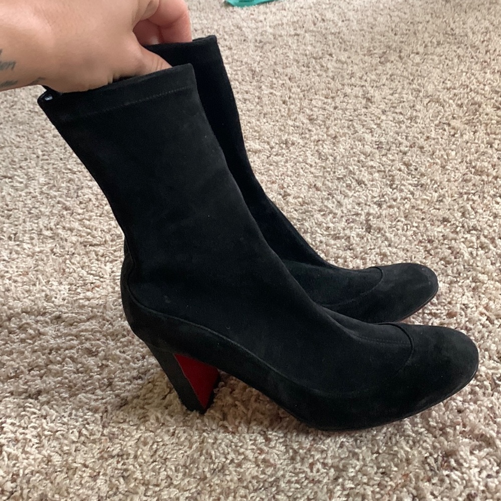 Black Christian Louboutin ankle boots.